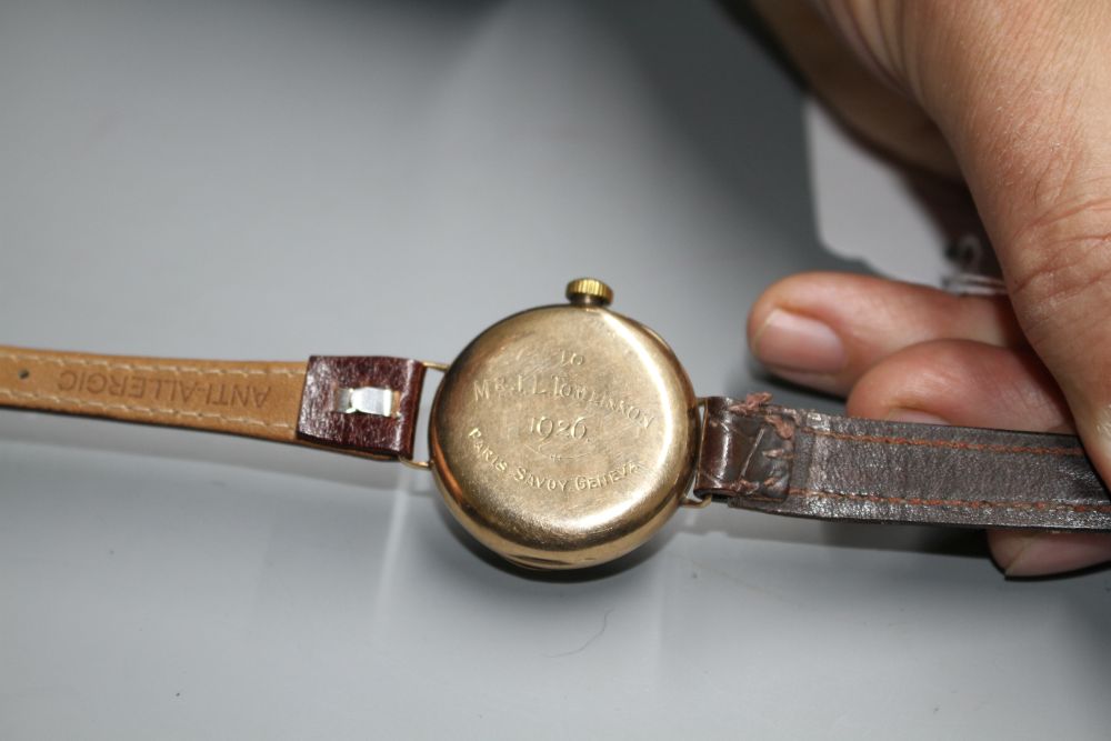 A gentlemans 1920s 9ct. gold manual wind wristwatch, with case back inscription.